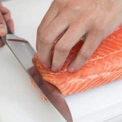 Chef slicing sushi